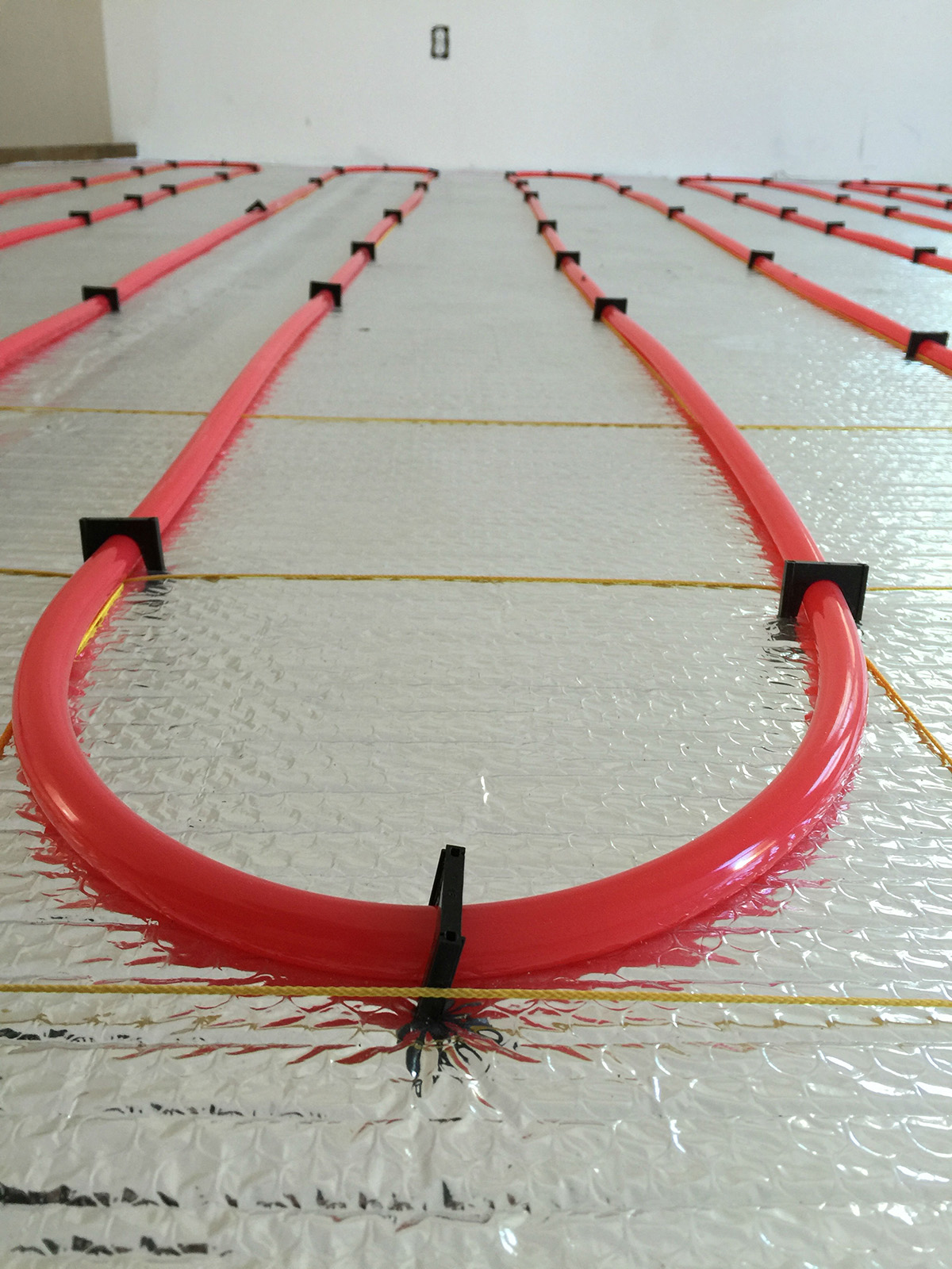 Radiant floor heating installation in 4 units