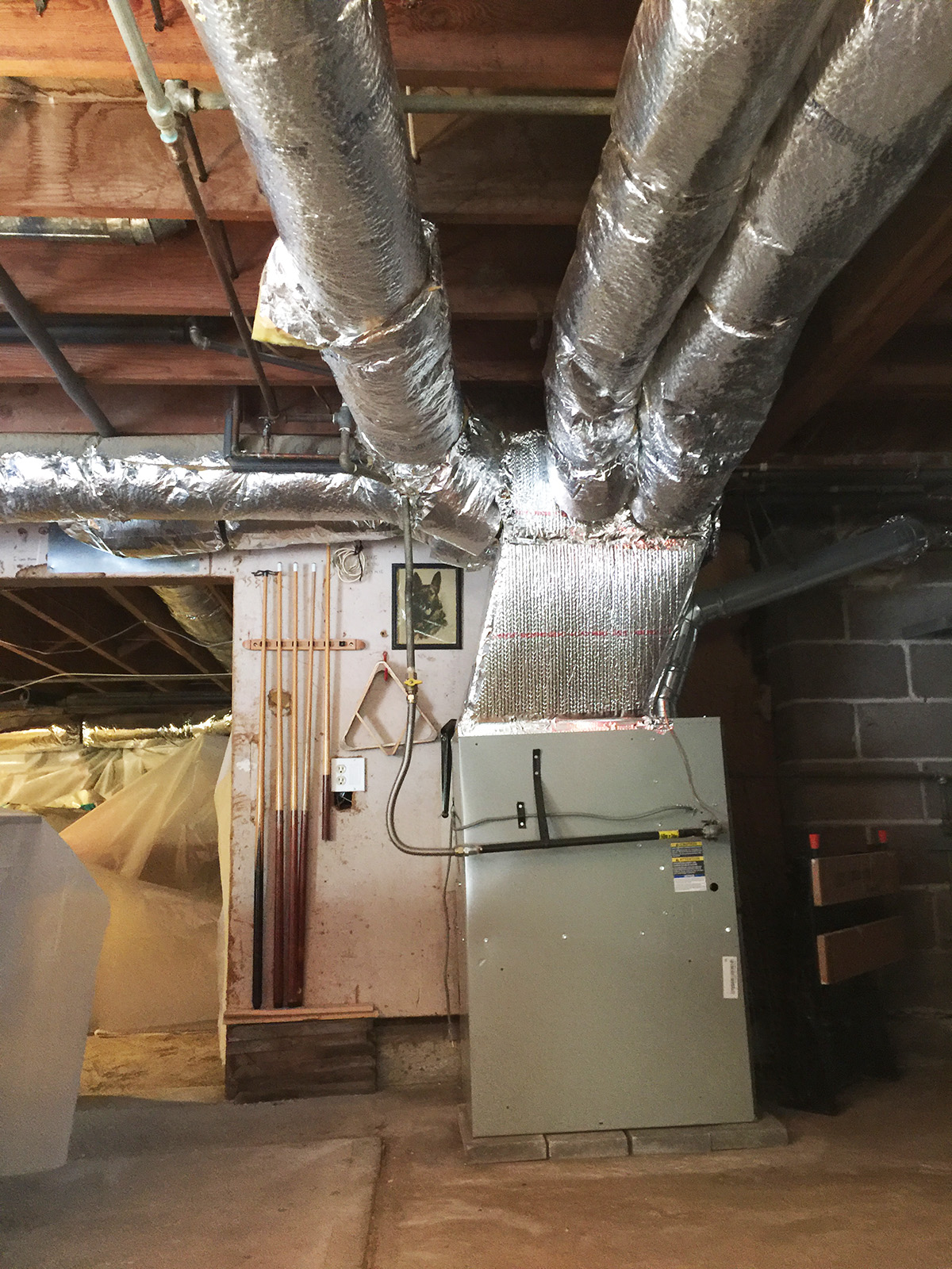 New air conditioner using existing furnace and flue pipe